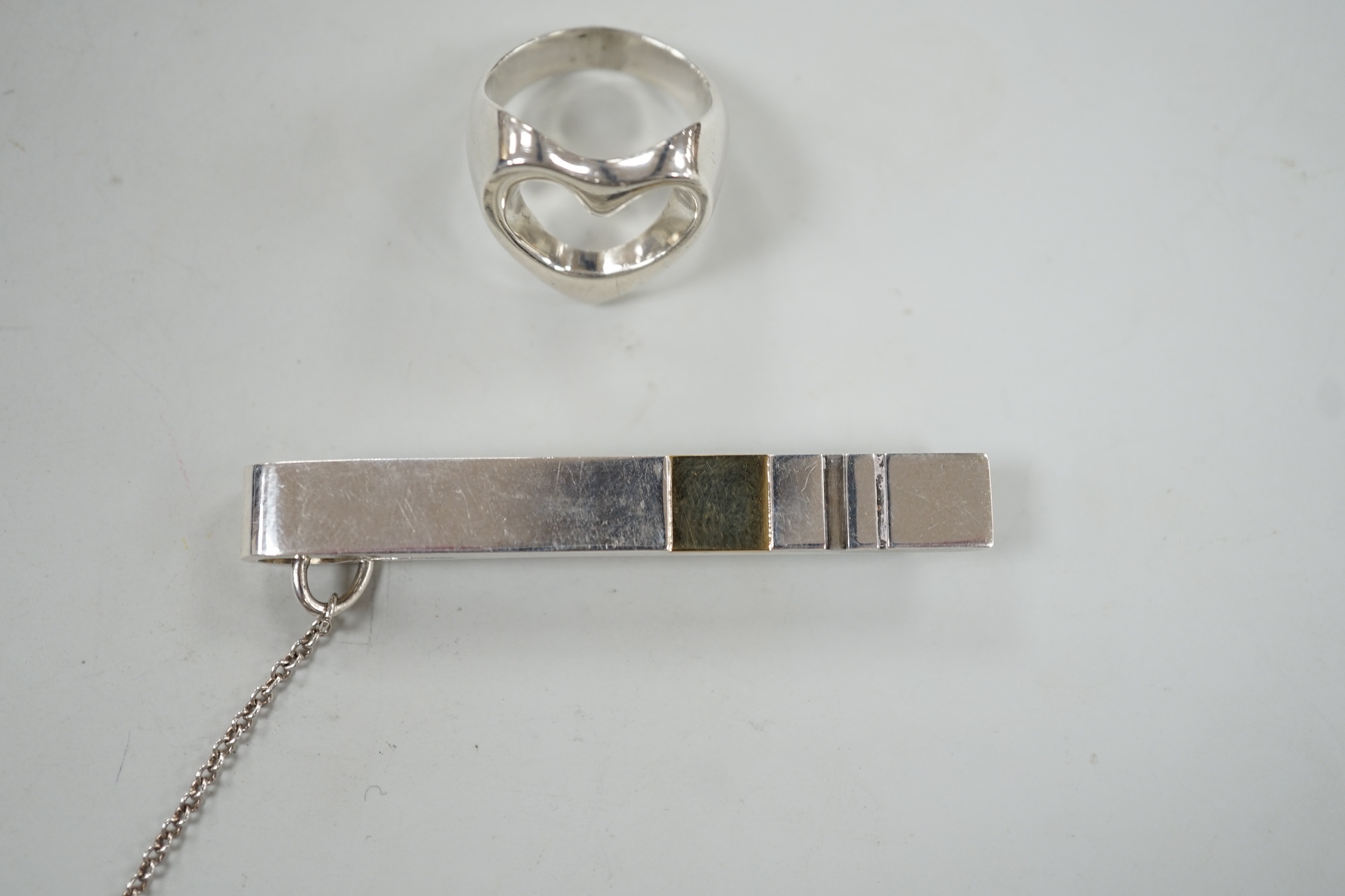 A Georg Jensen sterling pierced heart ring, size N and a Georg Jensen two colour sterling tie clip, design no. 152A, 58mm.